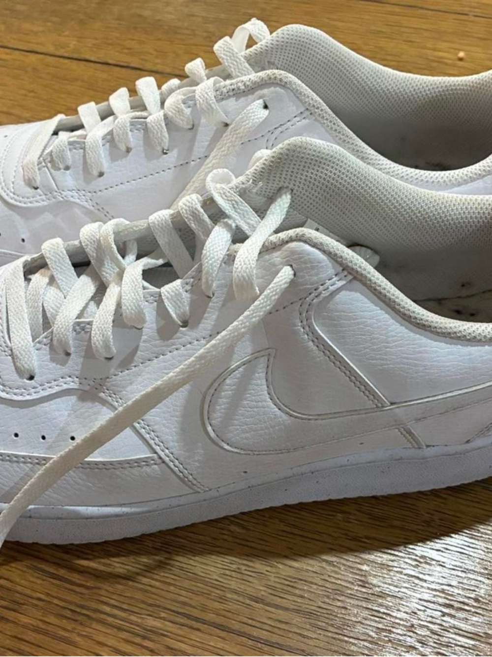 Nike All-White Low-Top Leather Sneaker Pair